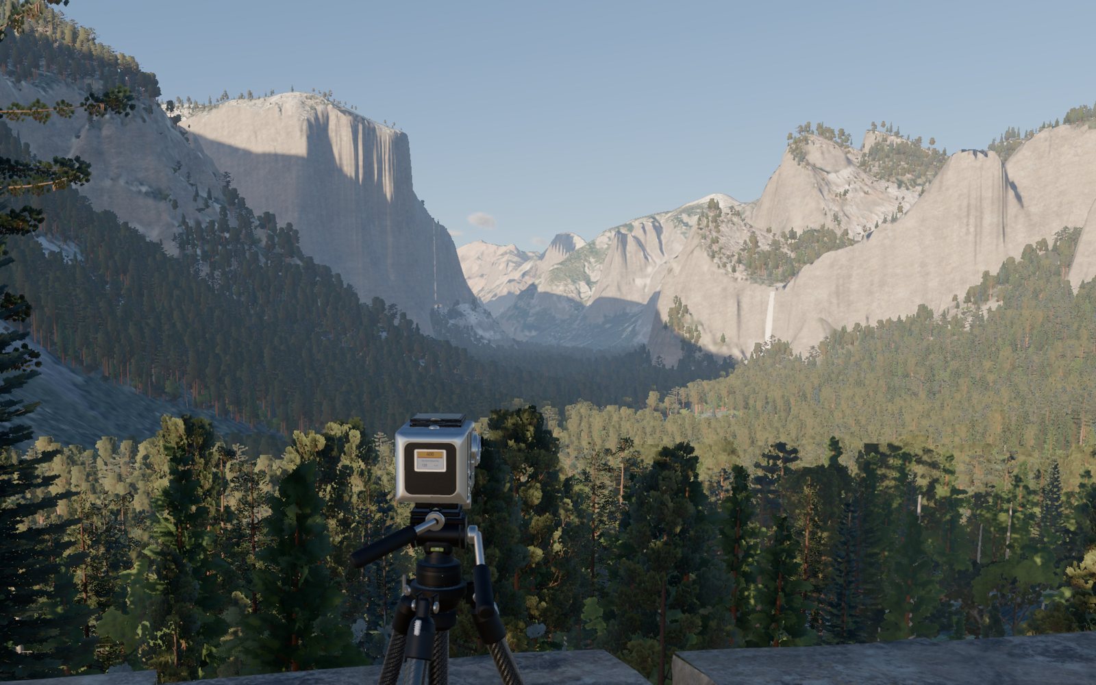 A medium-format film camera on a tripod in a granite valley at golden hour