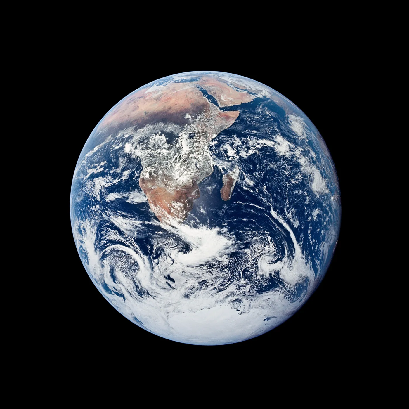 The whole Earth, fully lit: Africa, Arabia and the Antarctic ice cap under swirling white cloud